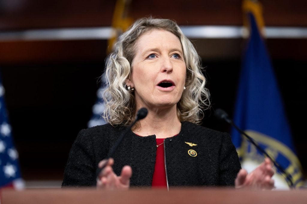 Rep. Jen Kiggans, R-Va., speaks at the microphone at the Bipartisan Defending Borders, Defending Democracies Act news conference at the US Capitol.