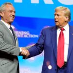 Republican presidential nominee former President Donald Trump shakes hands with Robert F. Kennedy Jr. during a meeting held in Duluth, Georgia, last month. Kennedy said over the weekend he would 'advise all US water systems to remove fluoride from public water.'