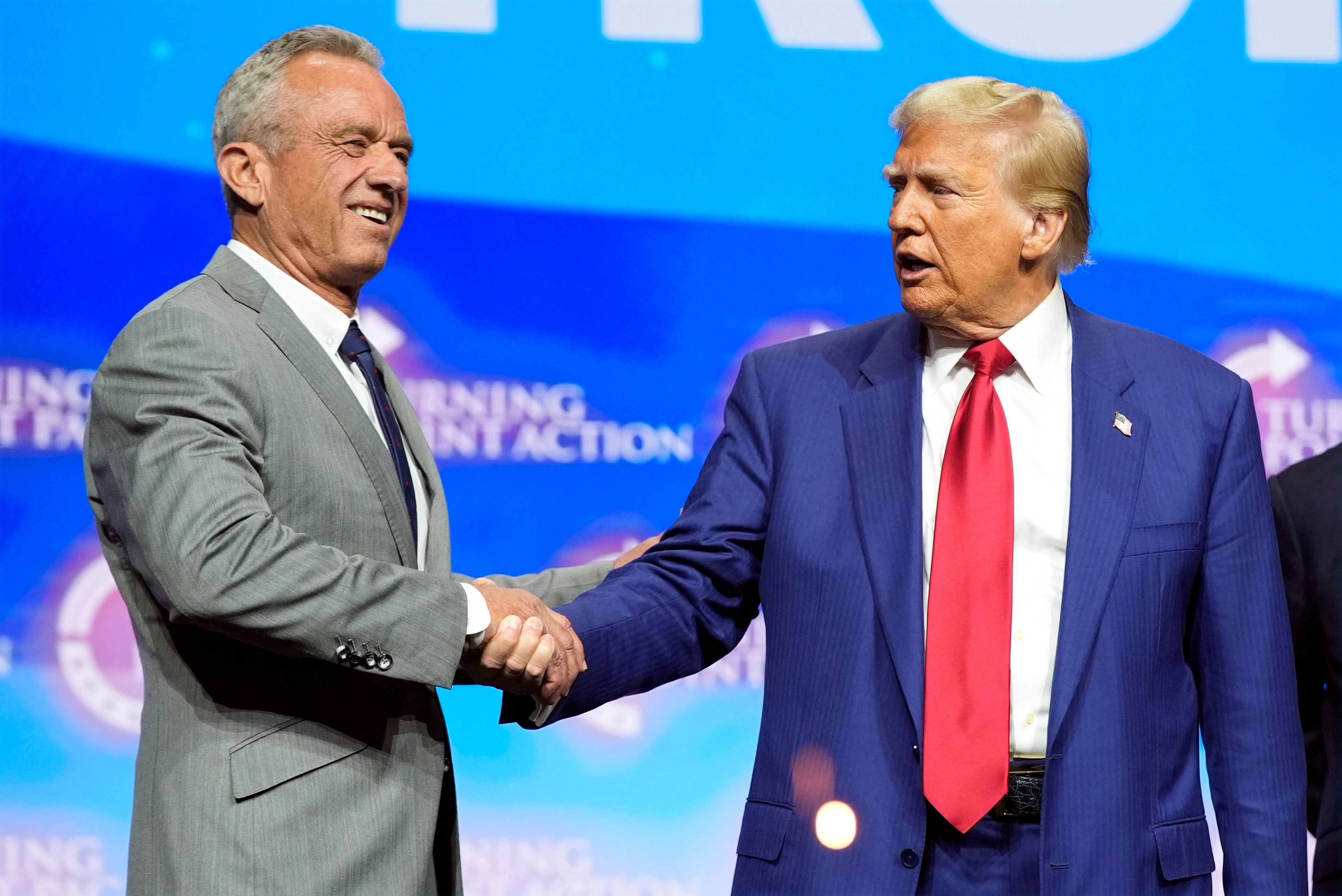 Republican presidential nominee former President Donald Trump shakes hands with Robert F. Kennedy Jr. during a meeting held in Duluth, Georgia, last month. Kennedy said over the weekend he would 'advise all US water systems to remove fluoride from public water.'